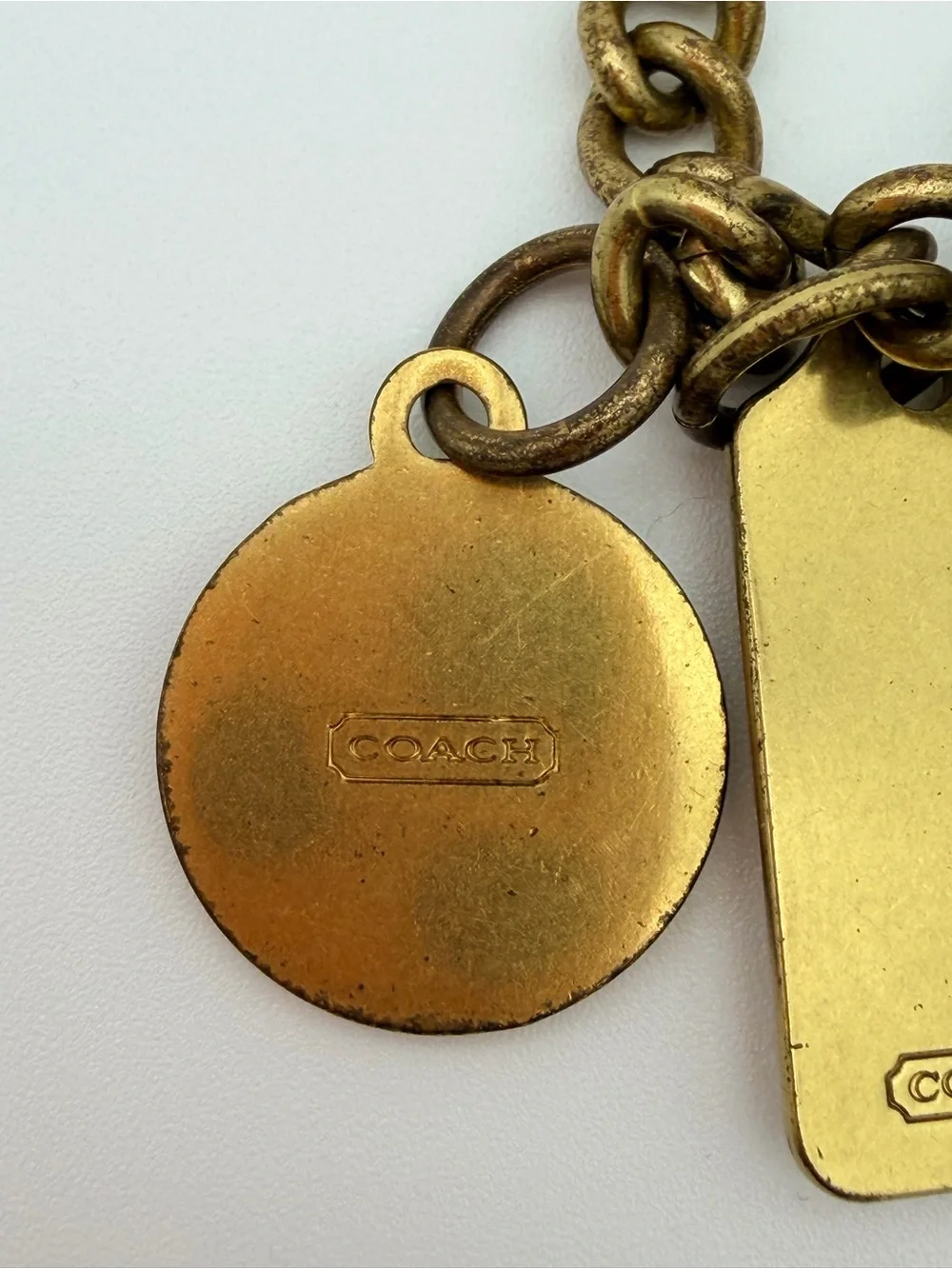 COACH Brass Charm Bracelet with Coach Tags & Horse Carriage Charm